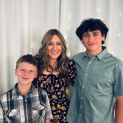 Jackie Rischette smiling with her two sons.